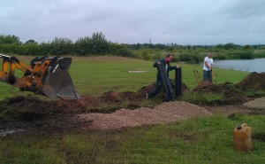 Laying the roadstone.