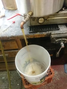 Cooled wort going into the fermenting vessel